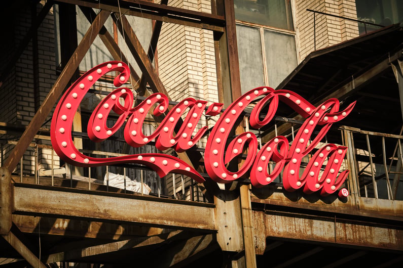 Coca-cola logo signage with lights on metal contruction