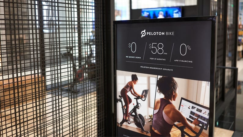 Peloton bike monthly payment plan advertisement is seen outside a Peloton showroom